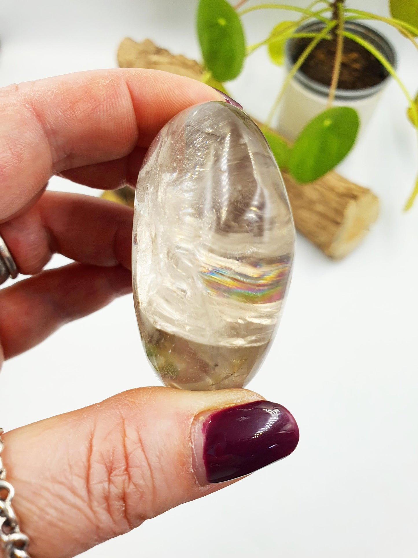 Clear Quartz Palm with shimmering inclusions and rainbows