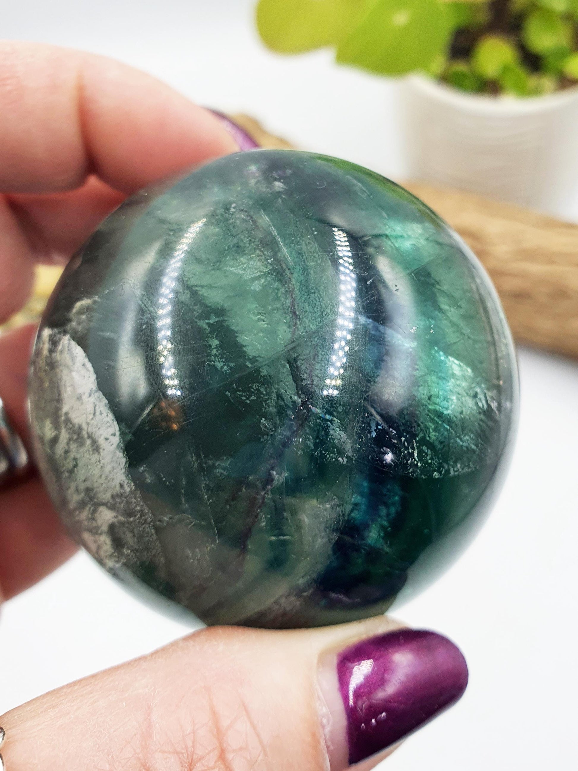 Green Fluorite Sphere with rainbow flashes