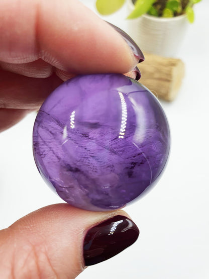 A Grade Amethyst Sphere with finger print inclusions