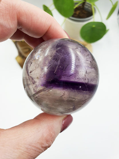 A Grade Phantom Amethyst Sphere with rainbow