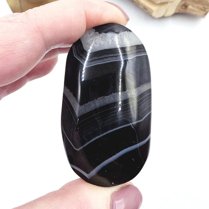 Banded Black Agate Palm Stone – Protection, Stability & Grounding Support Crystal, 80g